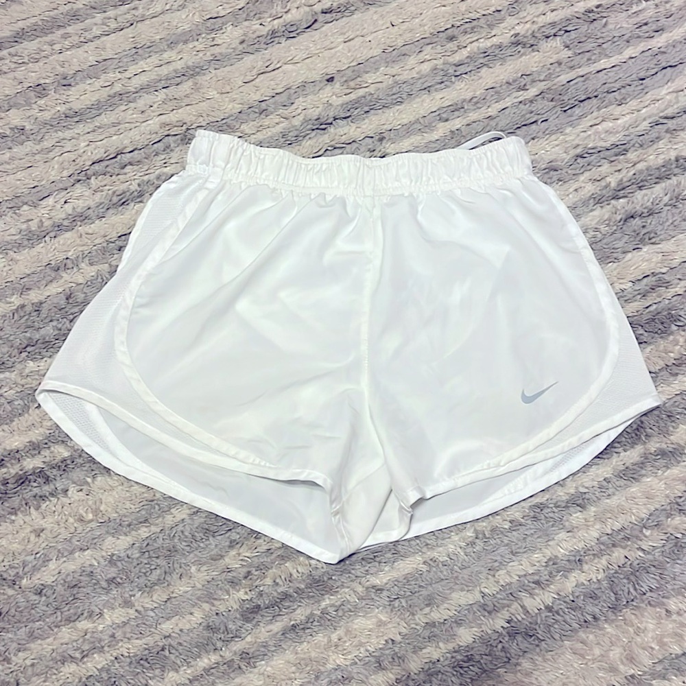 Nike Dry-fit white athletic shorts.